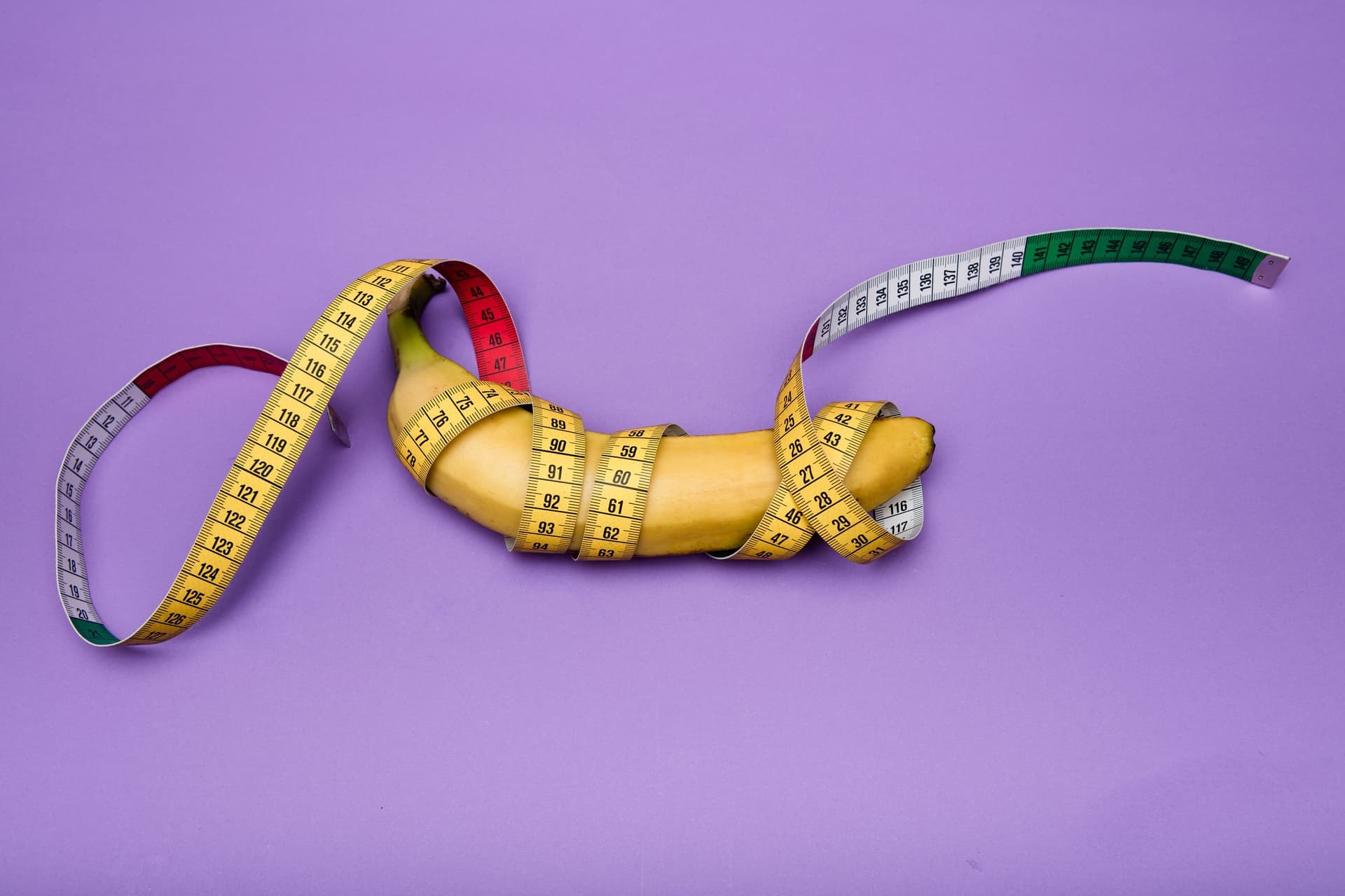 A measuring tape laid beside a large ceramic vessel