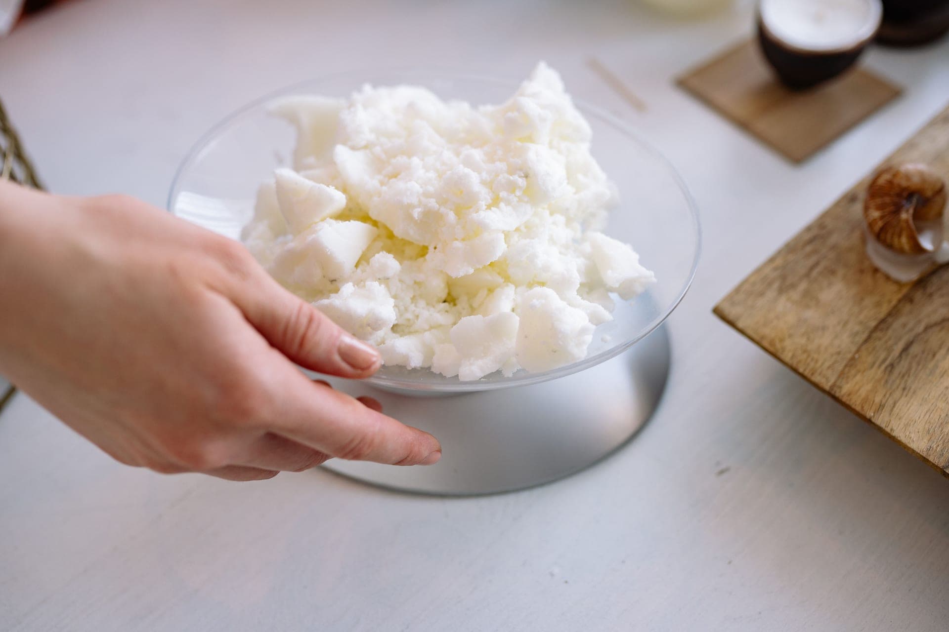 A digital kitchen scale on a counter with ingredients beside it