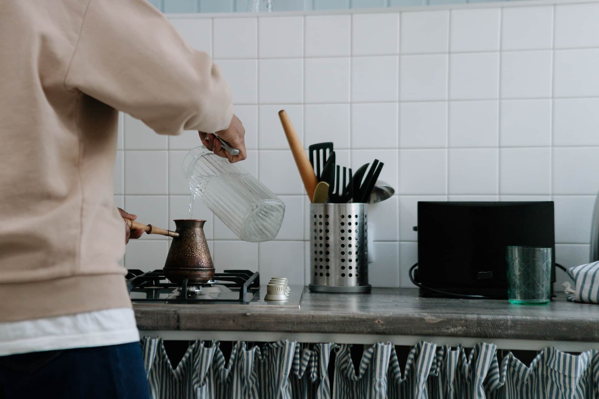 A multi-cooker appliance standing on a kitchen counter